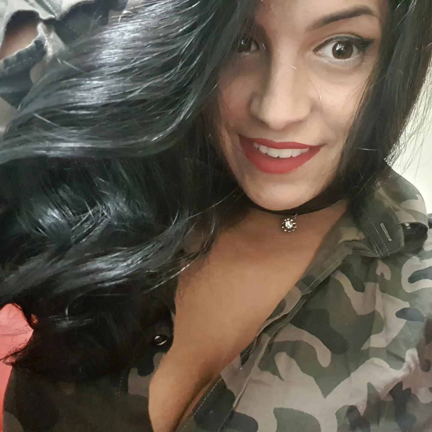 anaworld69 smiling at camera wearing camouflage shirt