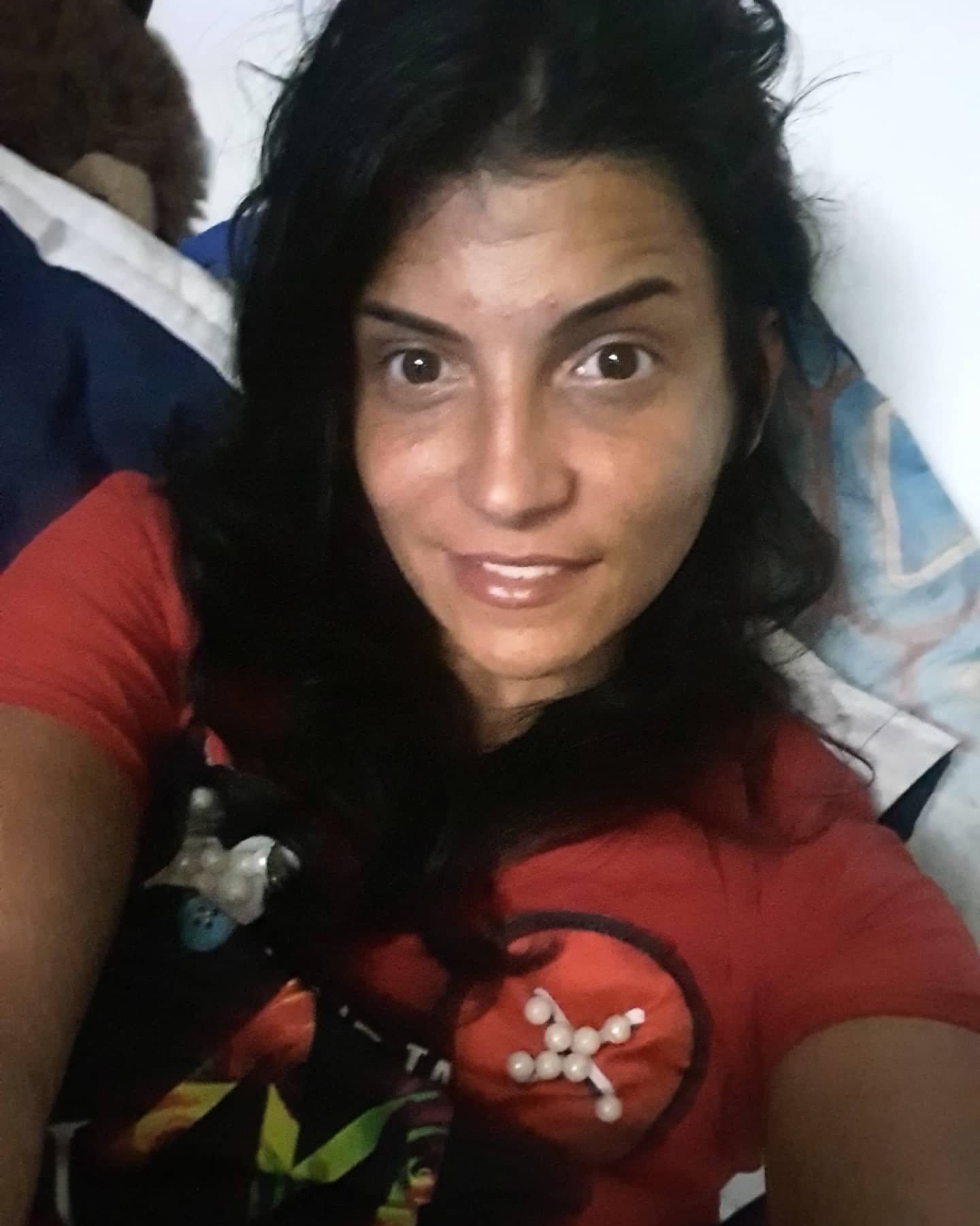 anaworld69 taking a selfie wearing red graphic t-shirt