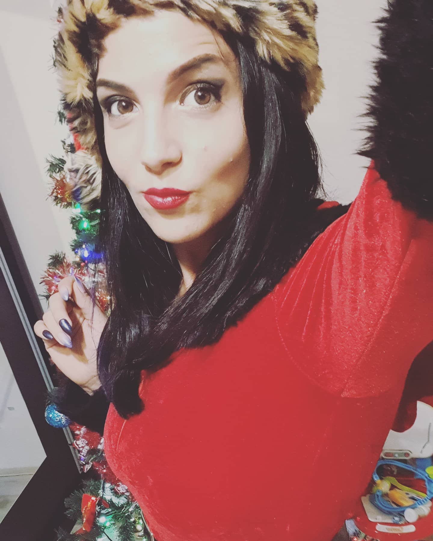 anaworld69 taking a selfie wearing red velvet top