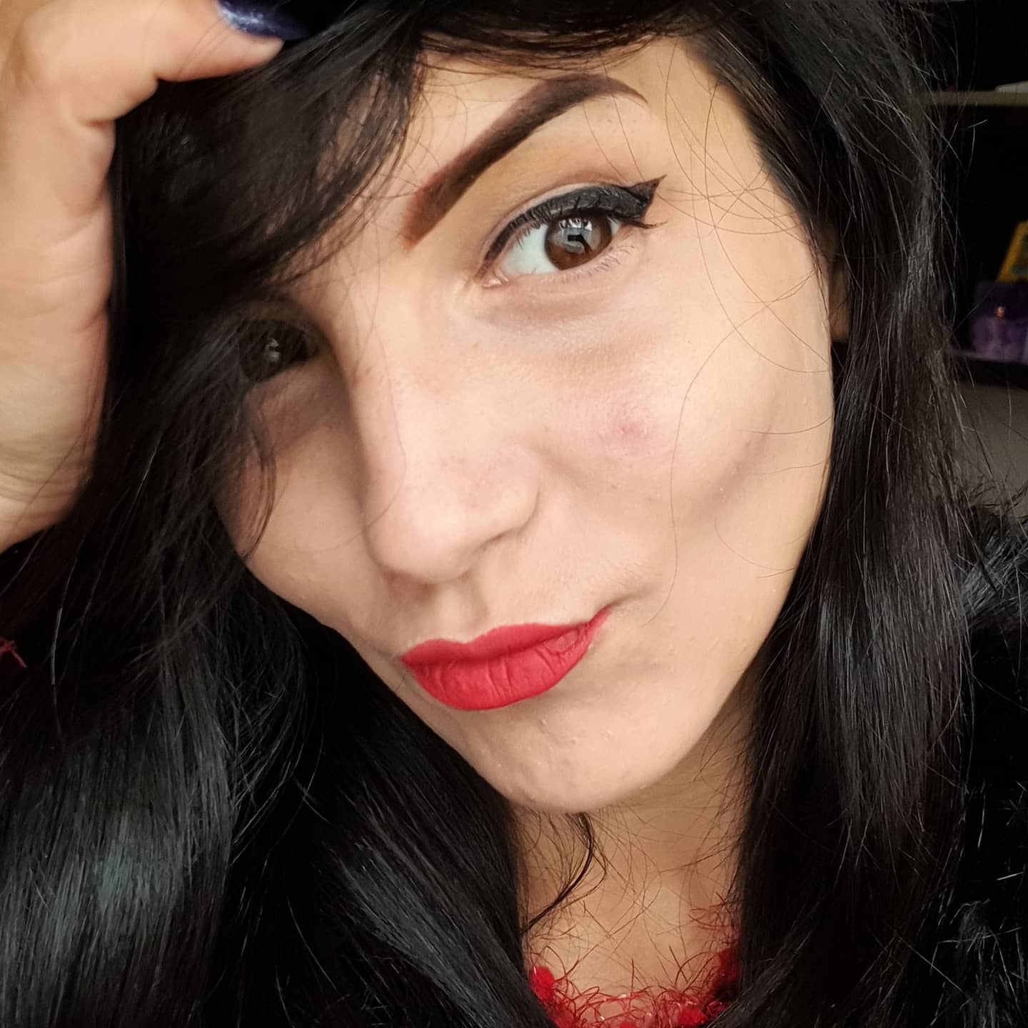 anaworld69 posing for selfie wearing red lace top