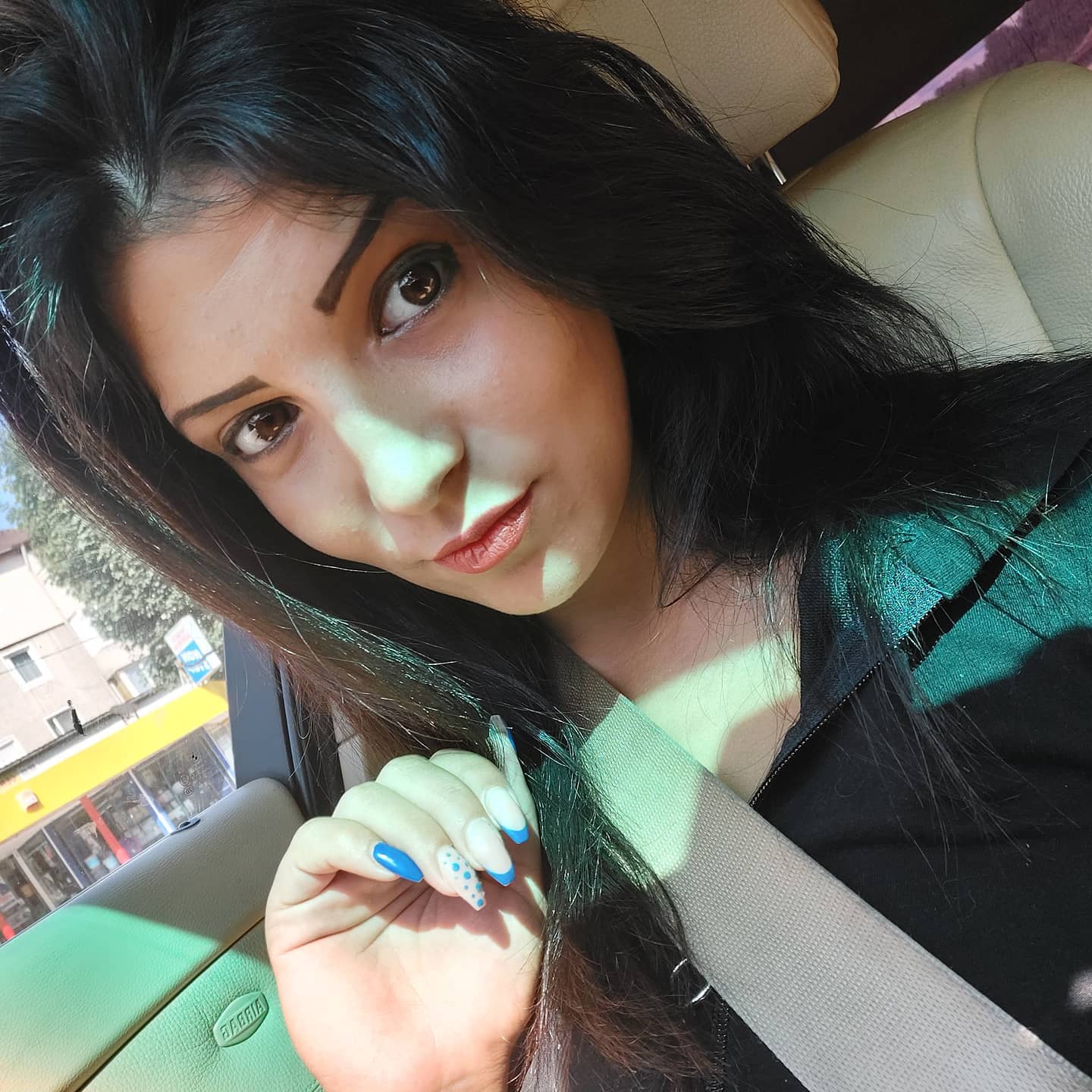 anaworld69 sitting in car wearing black top in car interior