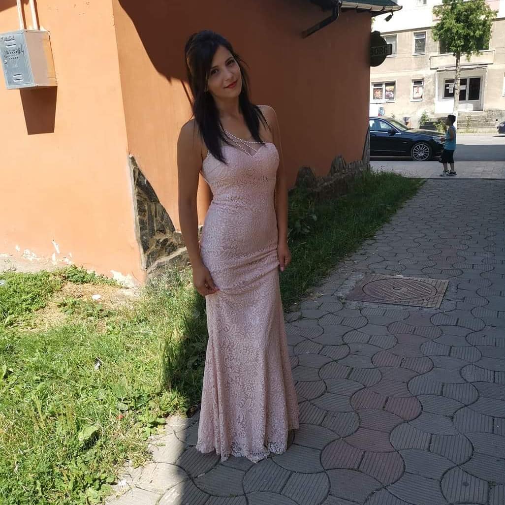 anaworld69 wearing light pink lace gown in paved sidewalk