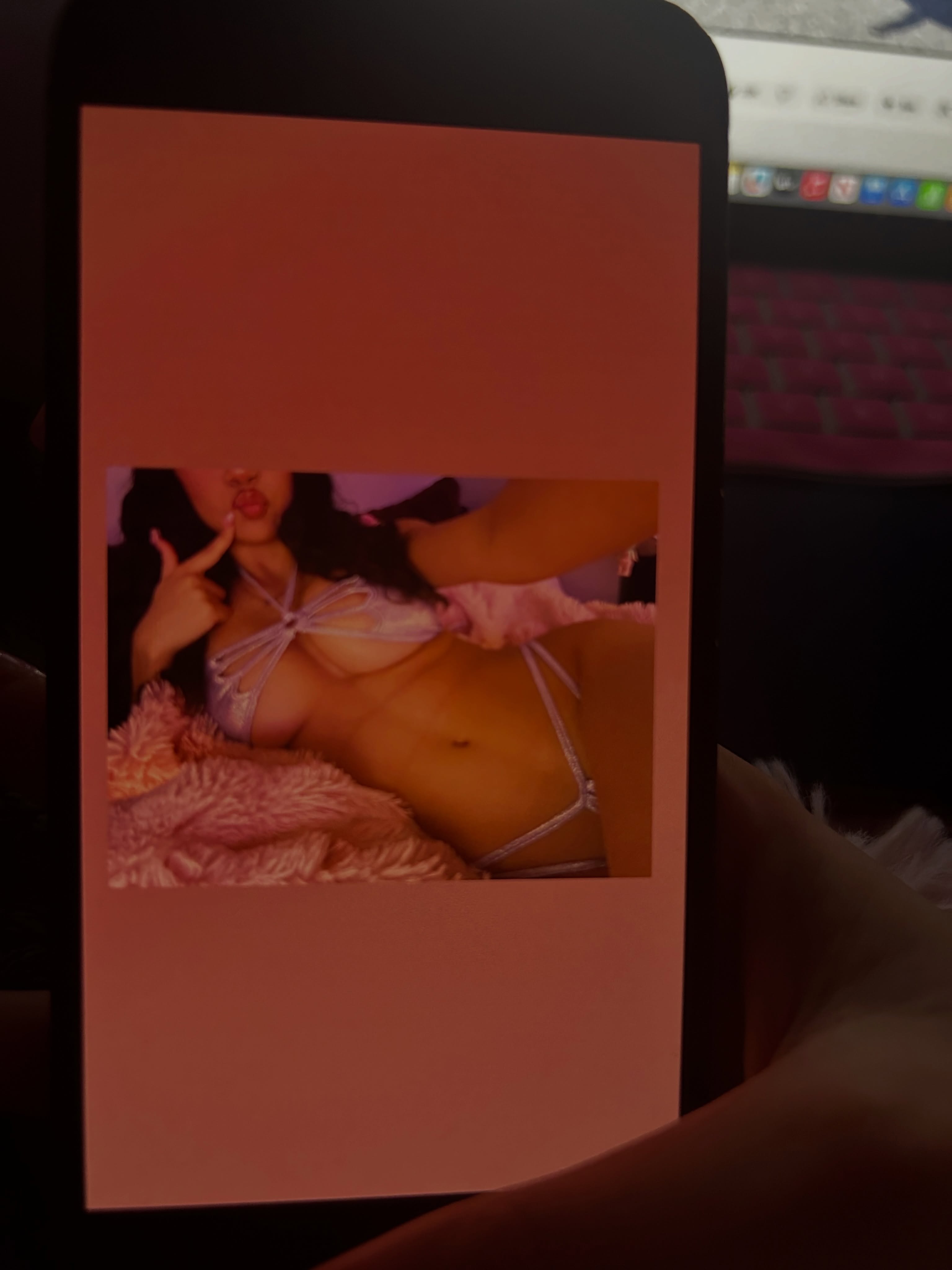 angelllsworlddd reclining on a fuzzy blanket wearing purple strappy lingerie set