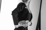 arlavitullo posing with hands on waist wearing black cropped jacket in studio