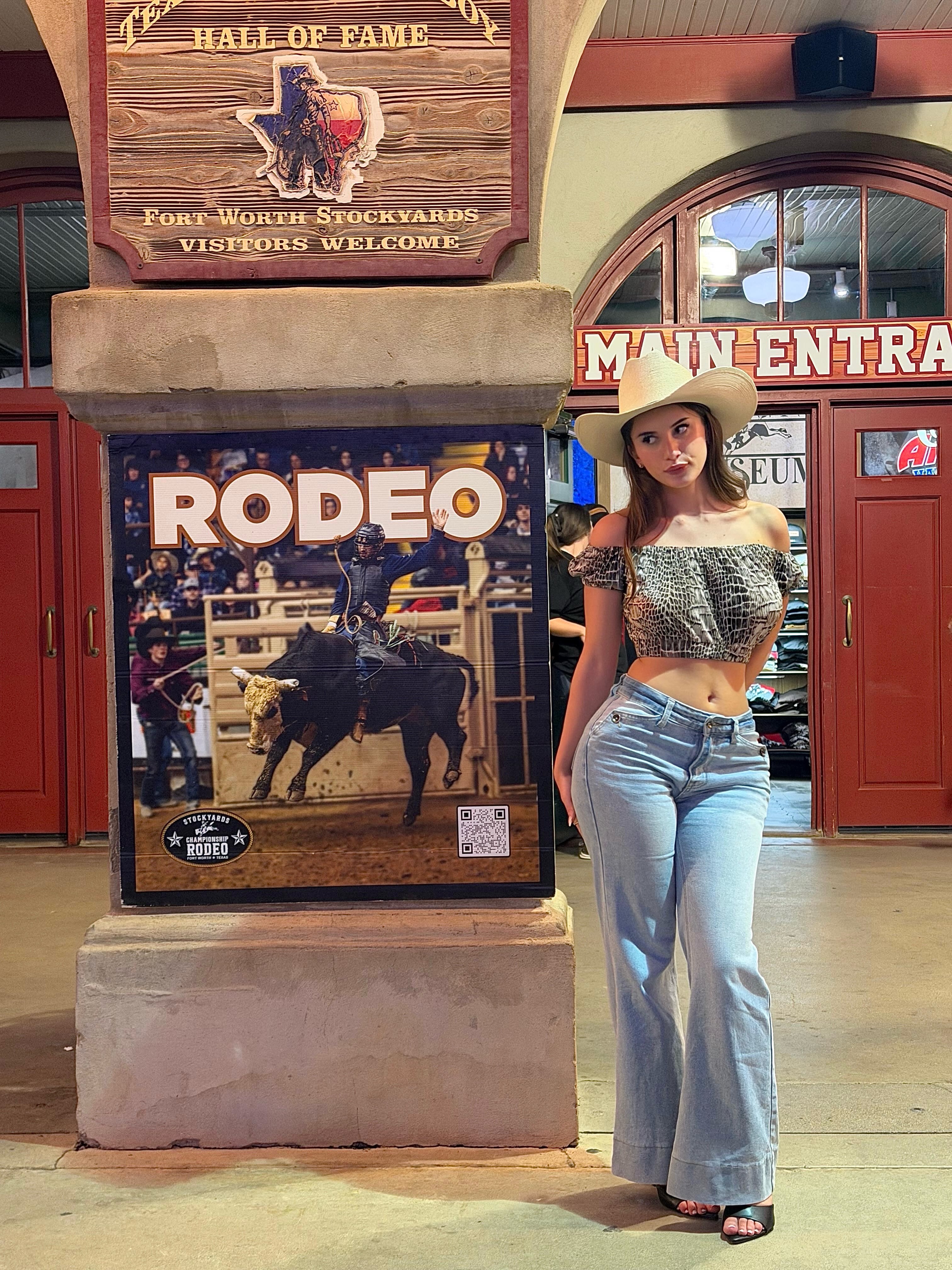 aviebby wearing beige cowboy hat in building entrance at Fort Worth Stockyards