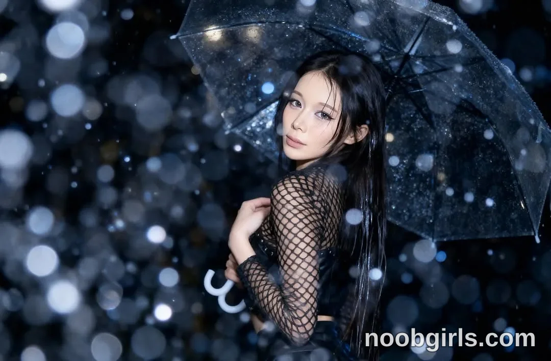Bae Bae Holding an open umbrella above her head wearing Black long-sleeved mesh top with a diamond-patterned open weave