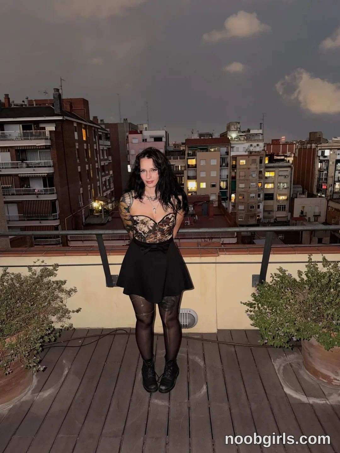 bexbex945874 wearing patterned corset top in rooftop terrace