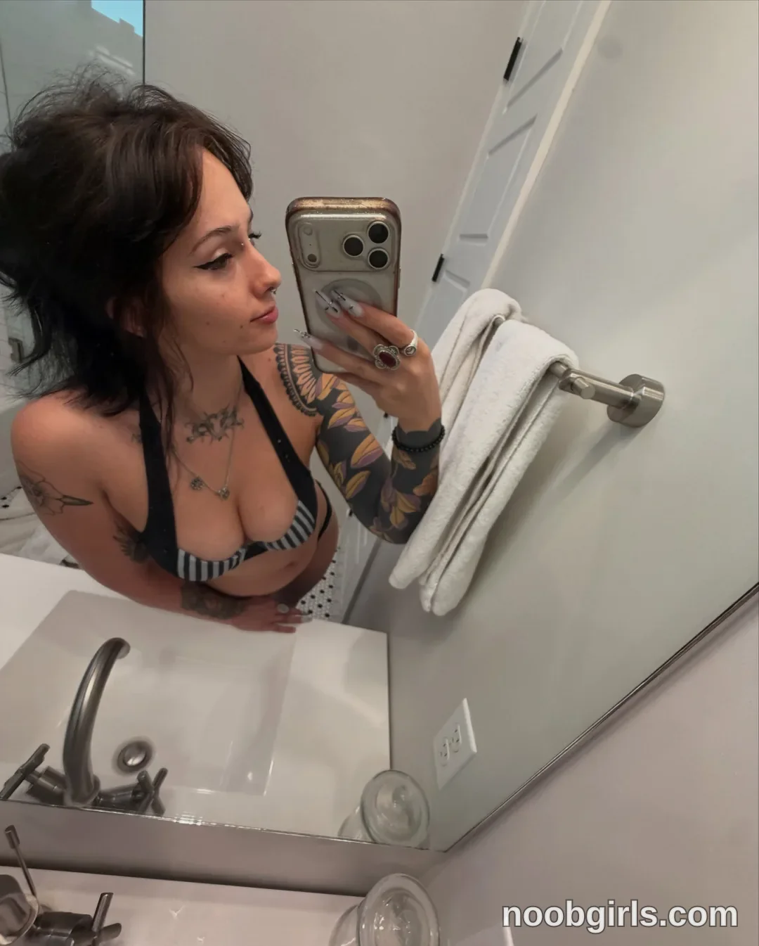 bexbex945874 taking mirror selfie wearing black and white striped top in bathroom
