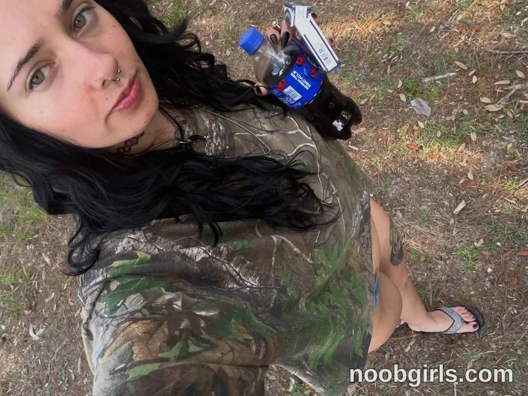 bexbex945874 holding bottle wearing camouflage shirt