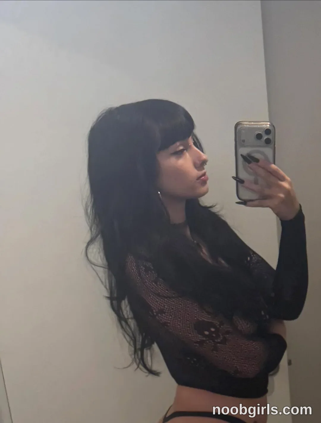 bexbex945874 taking a mirror selfie wearing black lace long-sleeve top