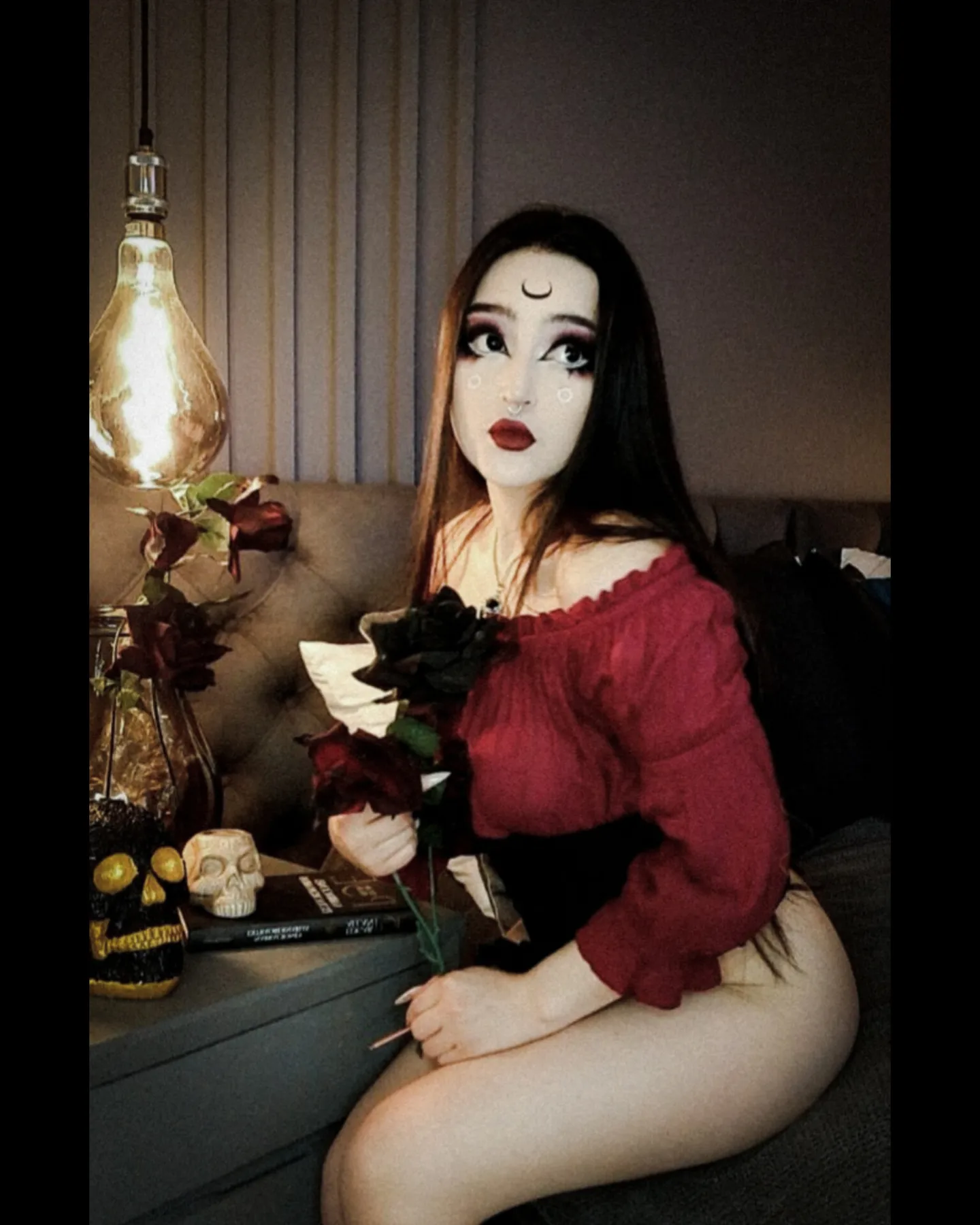 charlotte_germanotta_ holding roses wearing red off-the-shoulder top in bedroom