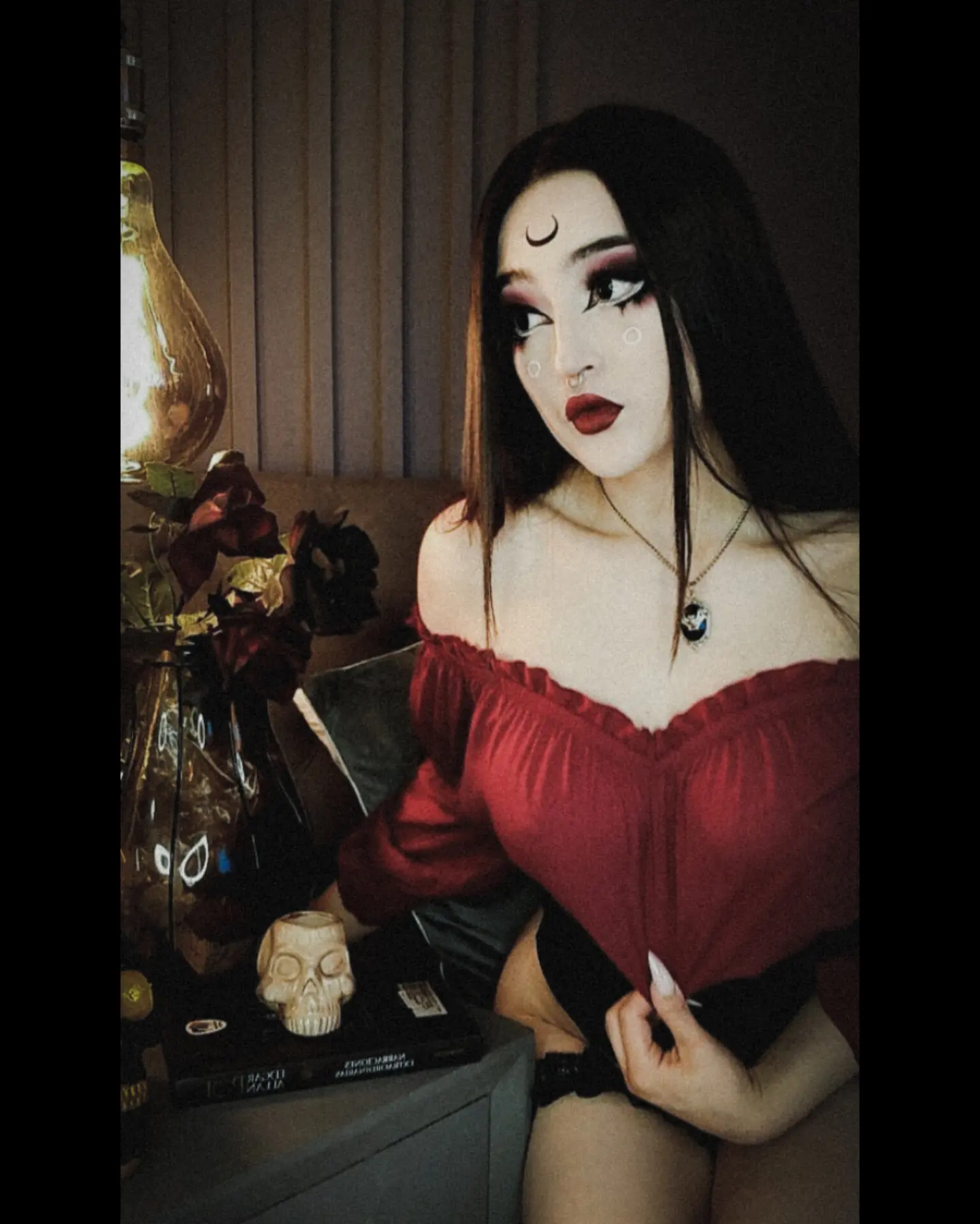 charlotte_germanotta_ wearing red off-the-shoulder top in room