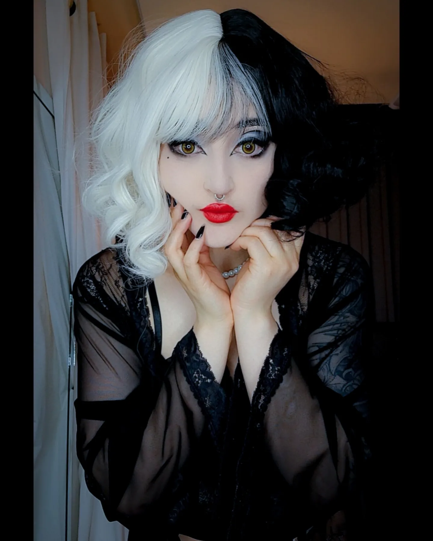 charlotte_germanotta_ posing with hands near chin wearing black lace robe