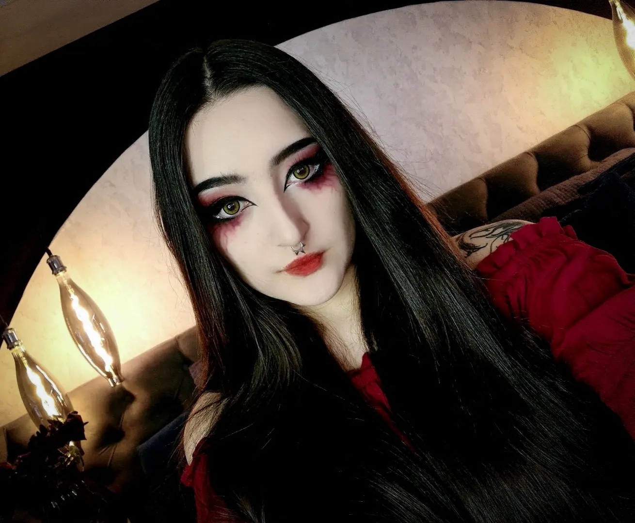 charlotte_germanotta_ wearing red off-shoulder top in room