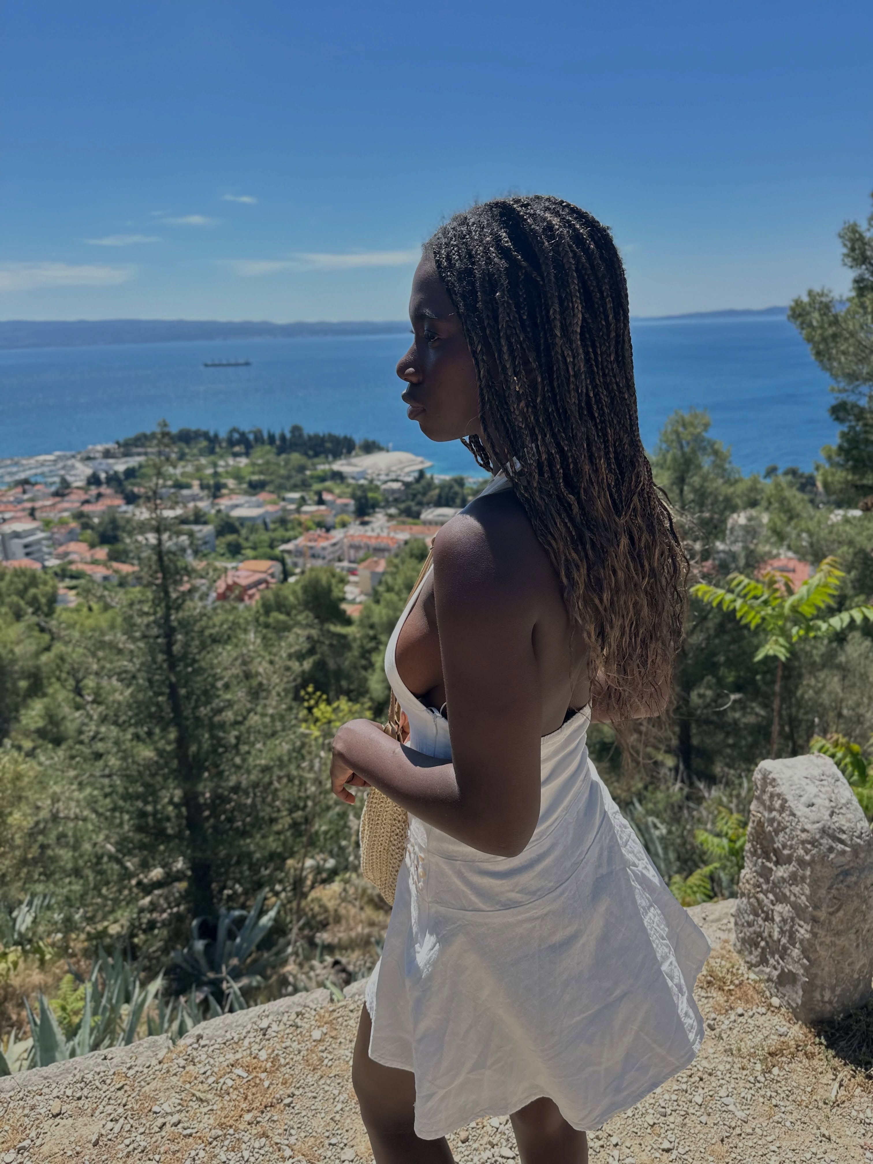 conymegan wearing white halter dress in coastal overlook