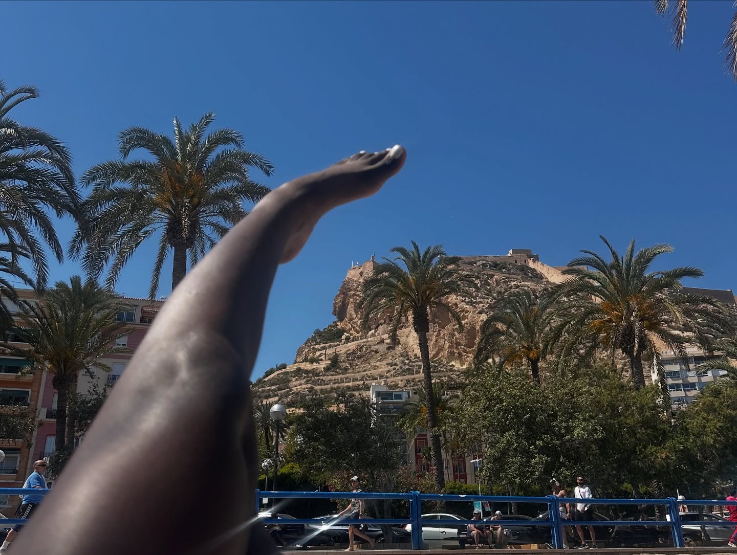 conymegan sunbathing in beach at Santa Bárbara Castle