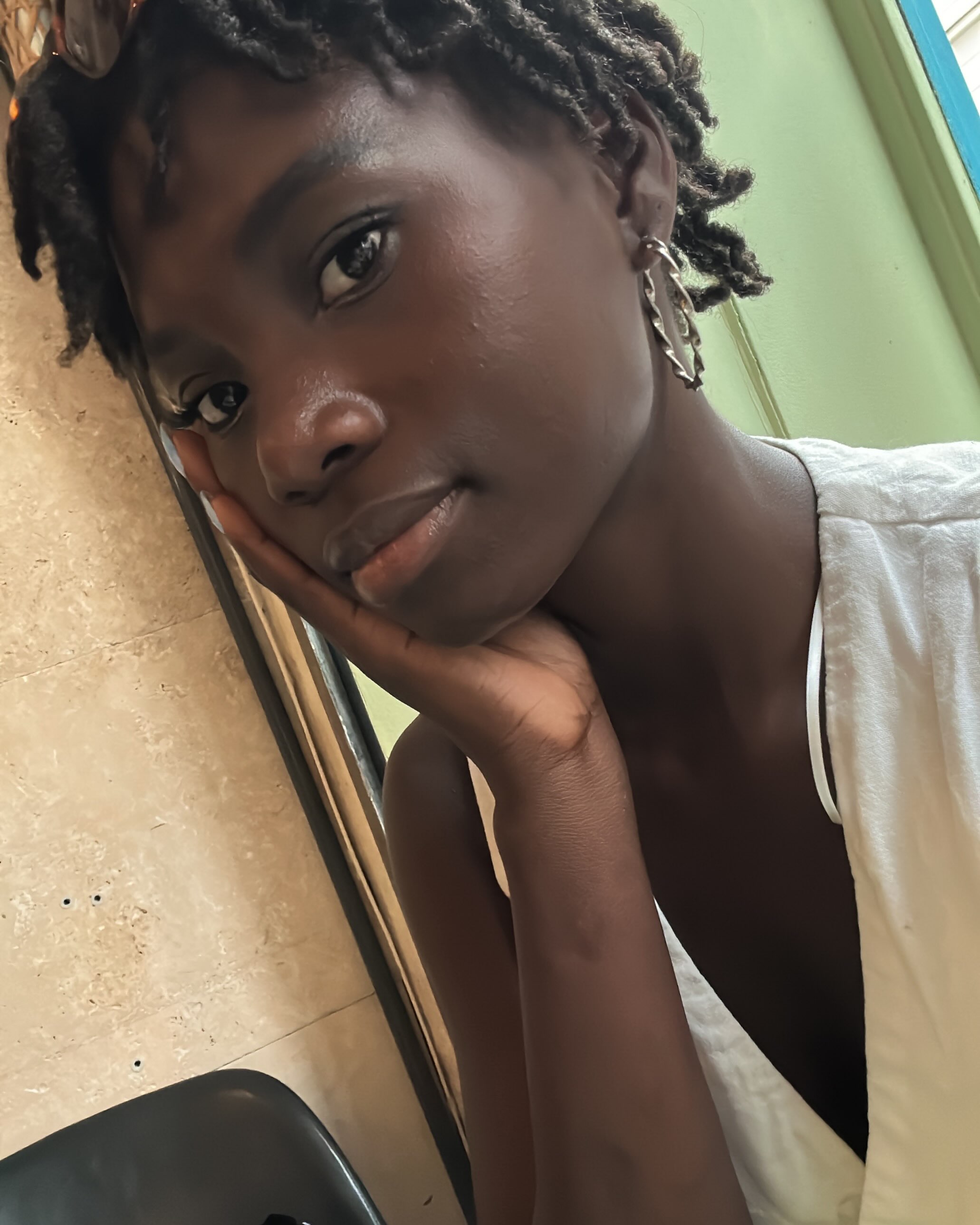 conymegan resting chin on hand wearing white top