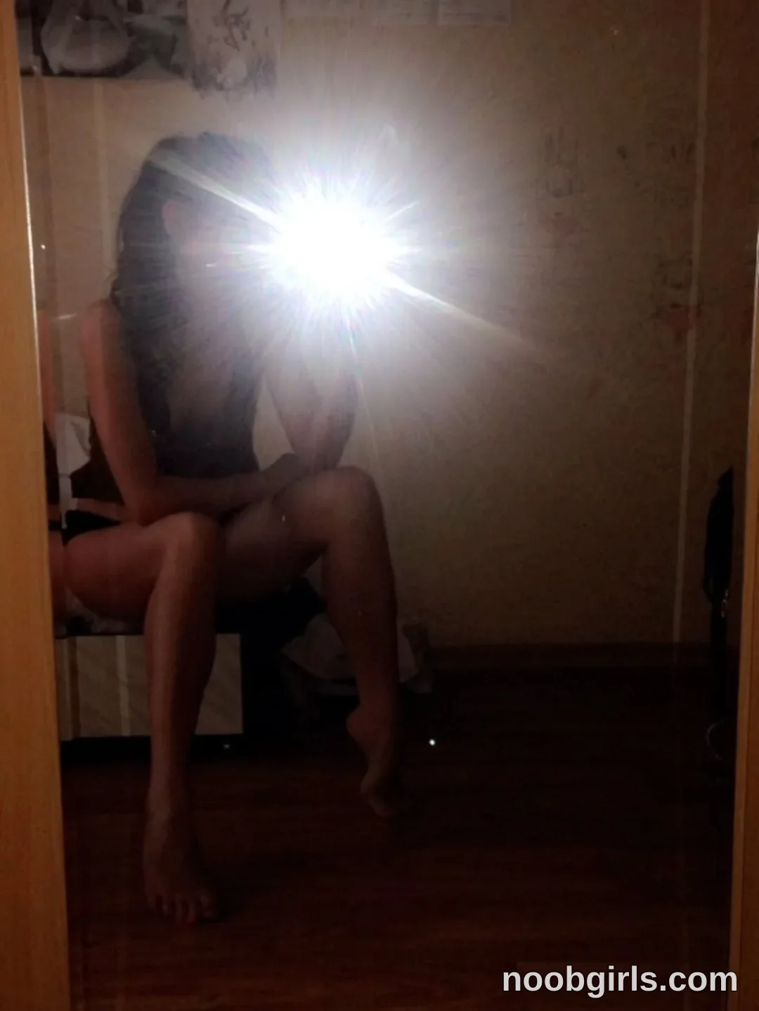 crystalnut taking a mirror selfie wearing black top in room
