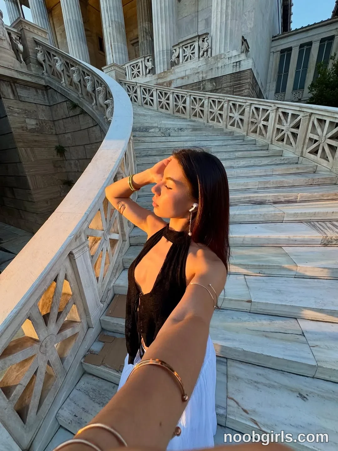 deniseglows Standing on the staircase with one arm extended toward the camera
