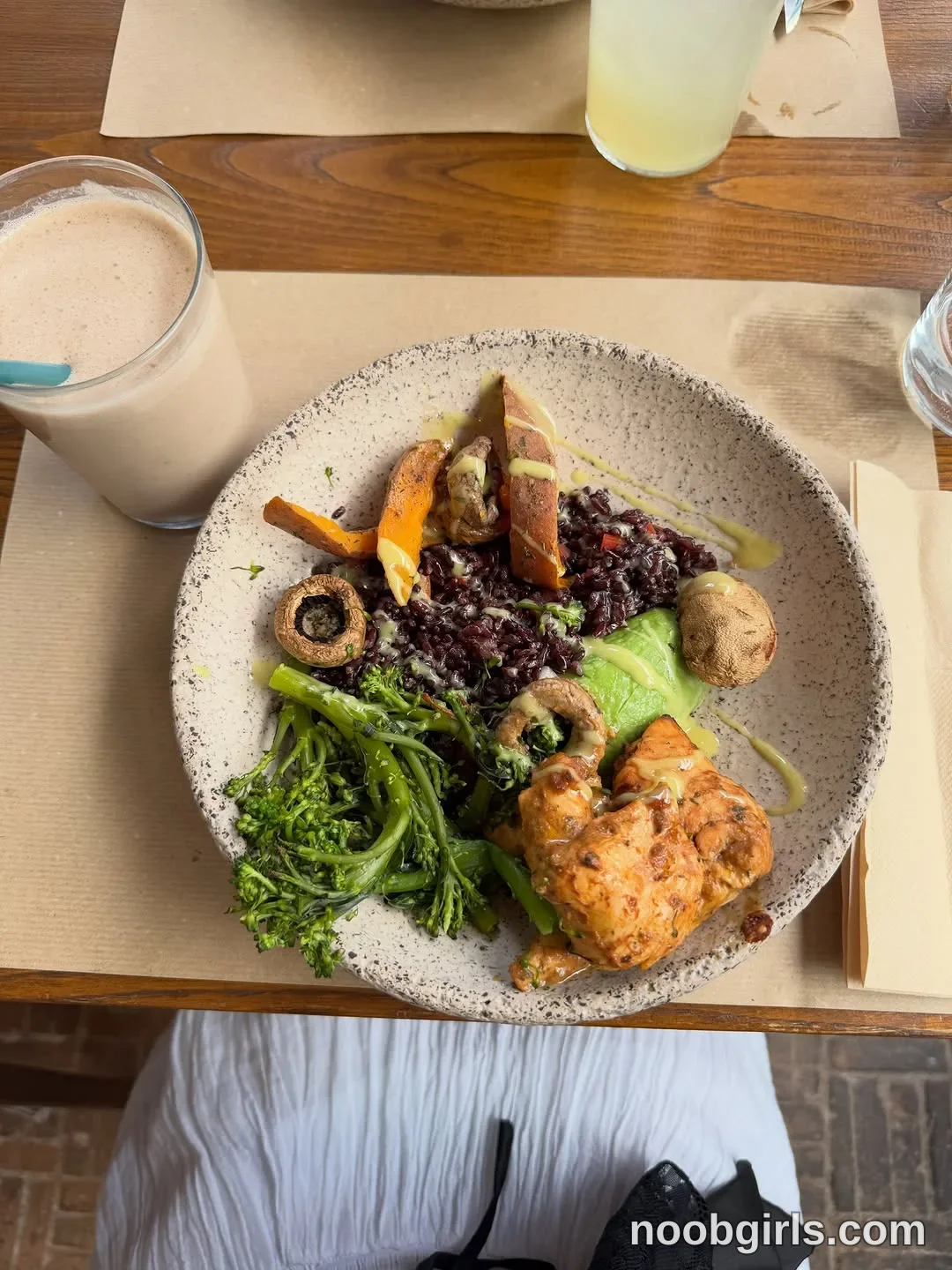 deniseglows Positioned at the table; no hands or physical action are visible