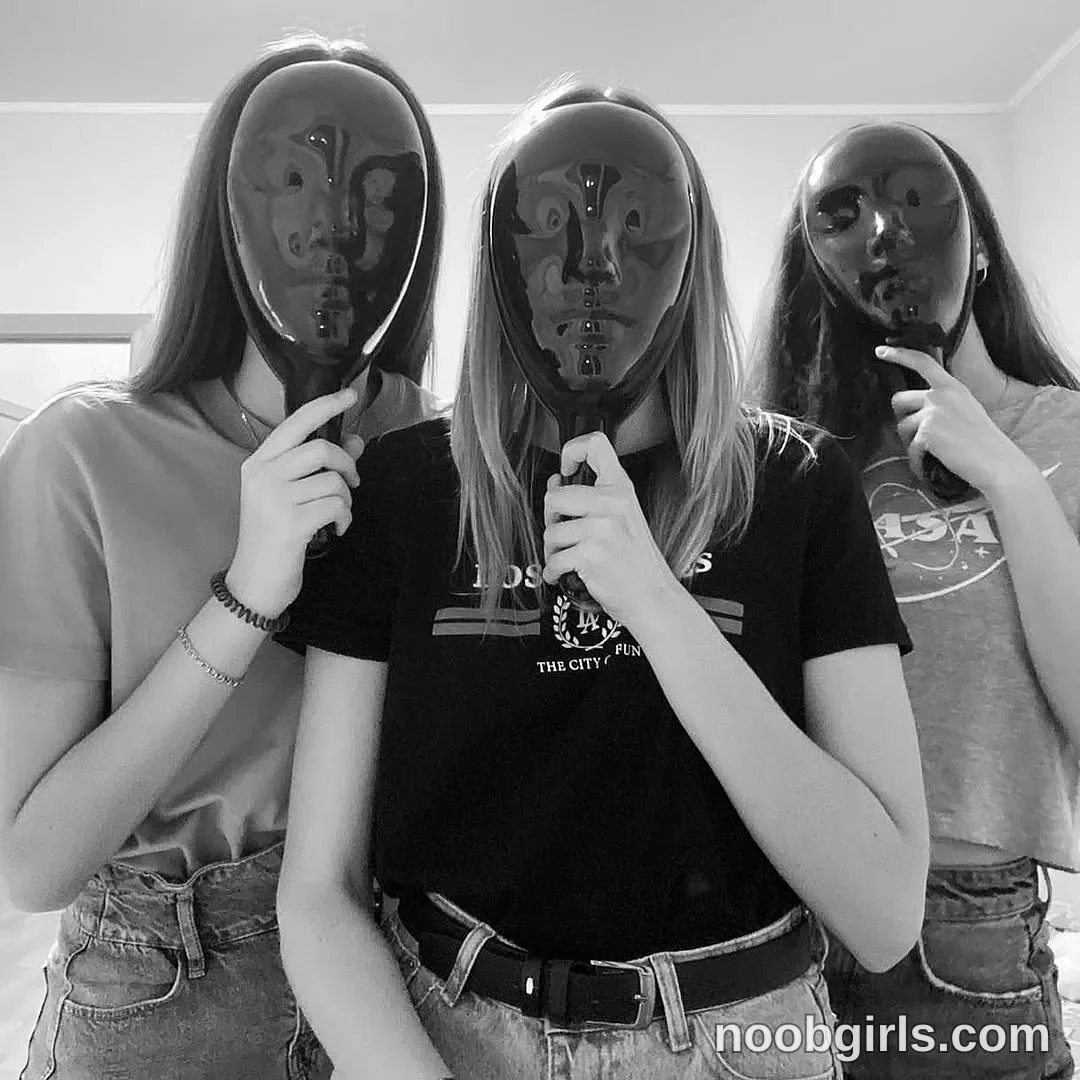 Eff Three people stand close together facing the camera