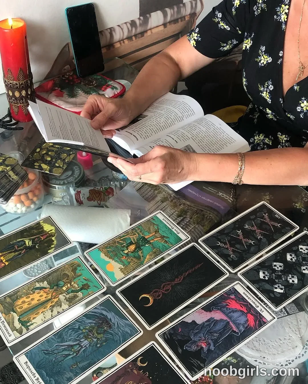Eff Holding an open book above the table with both hands
