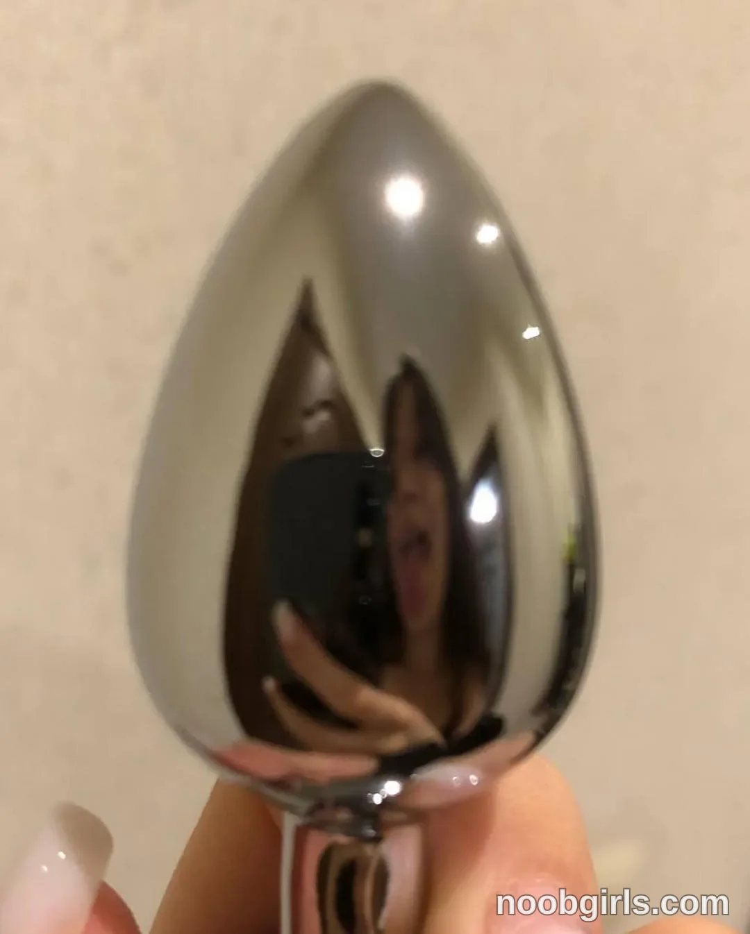 Eff Holding a spoon near the camera in the specific room is not identifiable