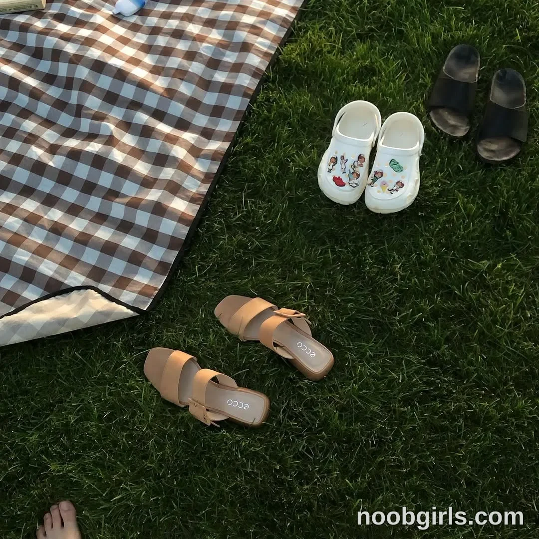 Eff Only part of a bare foot is visible at the bottom edge; no activity can be determined. on a grass lawn