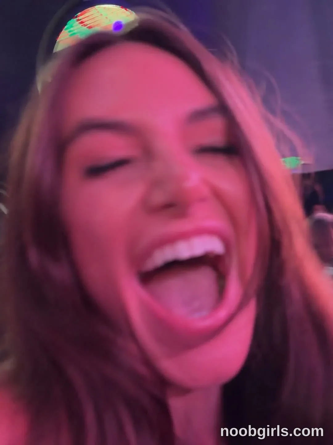 Gracie Smith Facing the camera with her mouth open in Appears indoors; specific type of venue is not identifiable