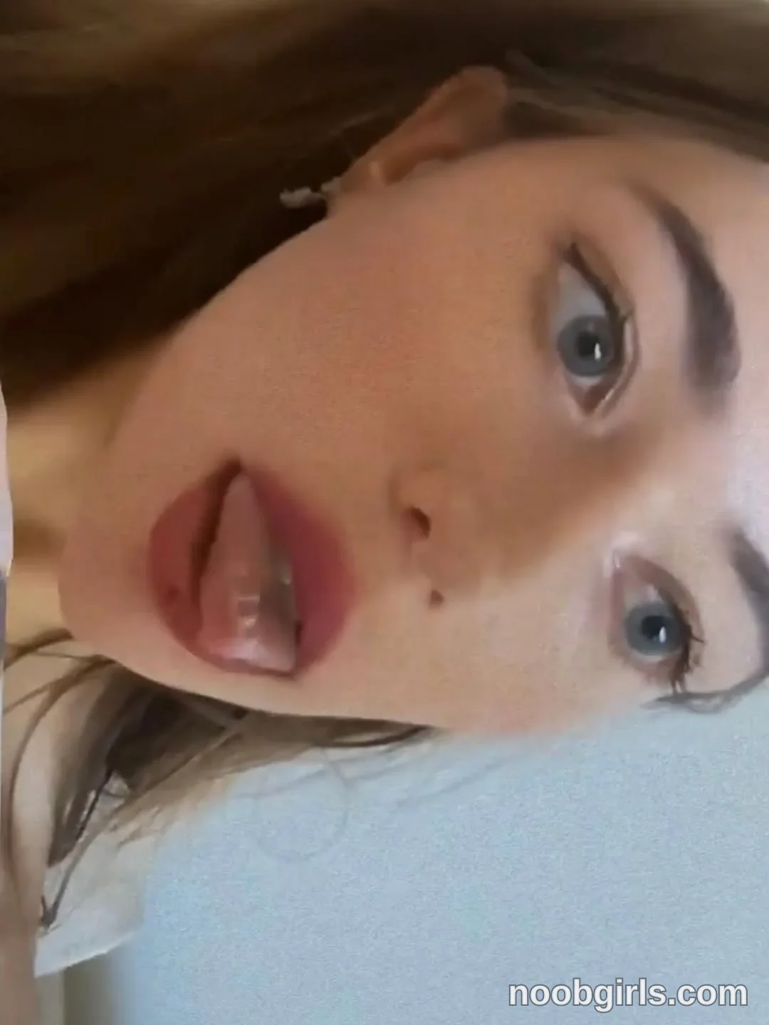 HayleyPrincess Holding her head sideways wearing Partially visible white top