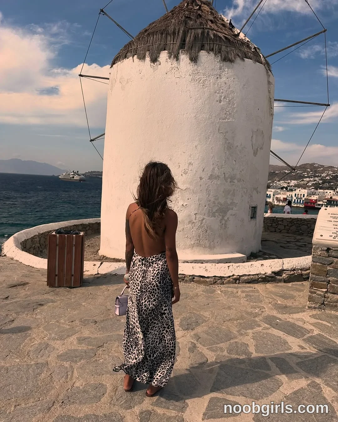 LennaGoddess Standing with her back to the camera