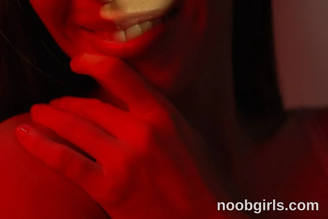 Lucie smiling with lips parted in studio or room