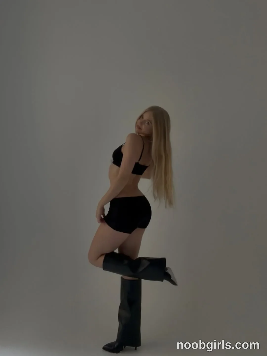 Miablueye wearing black bra-style top in photo studio