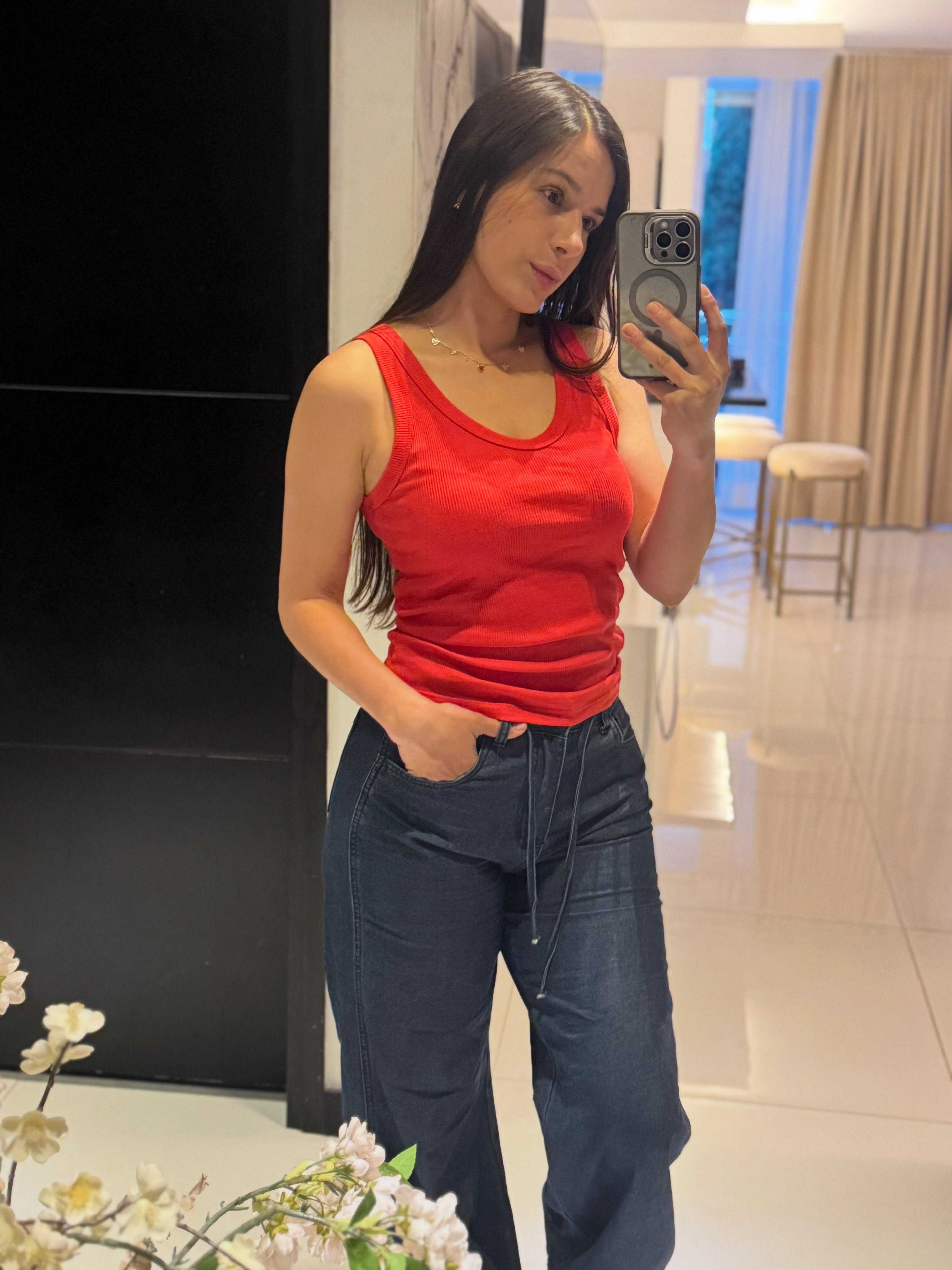 ohanna taking a mirror selfie with a smartphone wearing red ribbed scoop-neck tank top