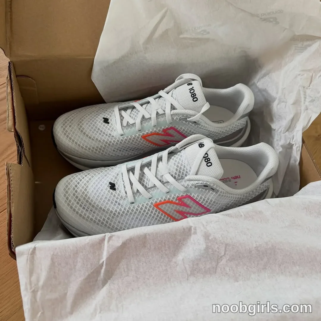 Xena No person is visible; the shoes are resting inside the shoebox in an open shoebox on a wooden surface in Belgium, Europe