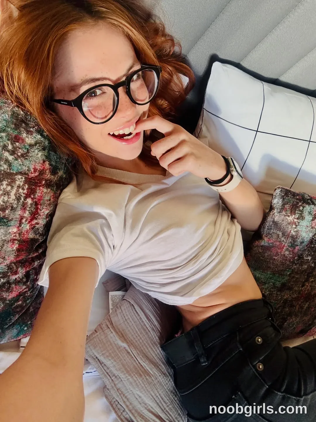 Pinkypupa-Love Reclining with one arm extended toward the camera wearing White short-sleeved T-shirt gathered above the waist