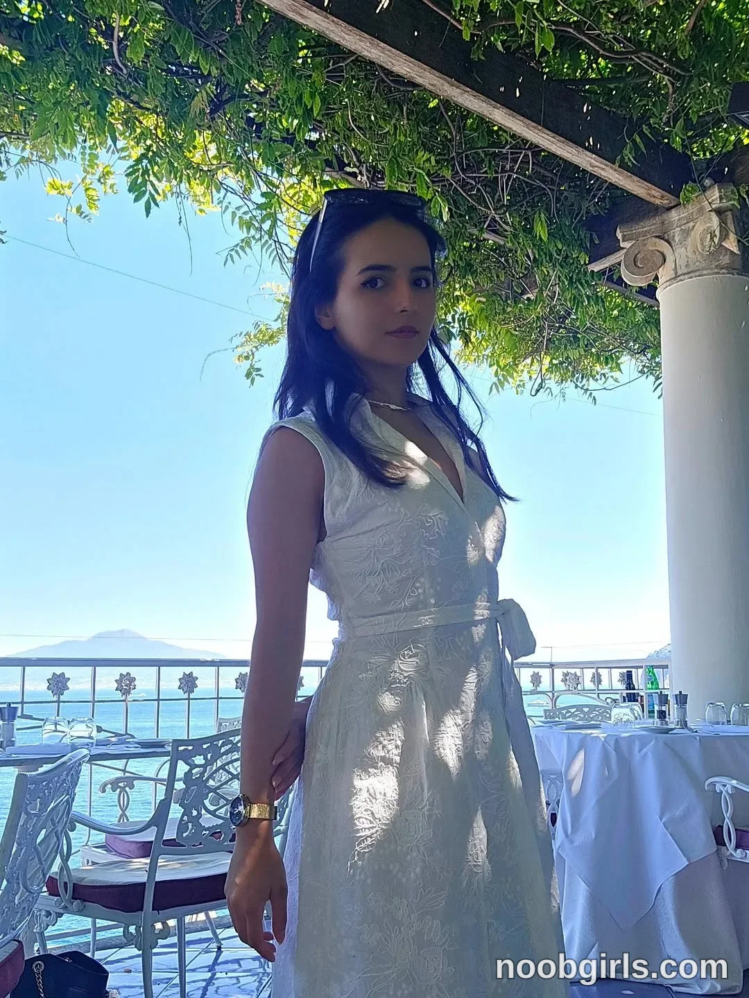 Raychell Black standing beside the dining tables