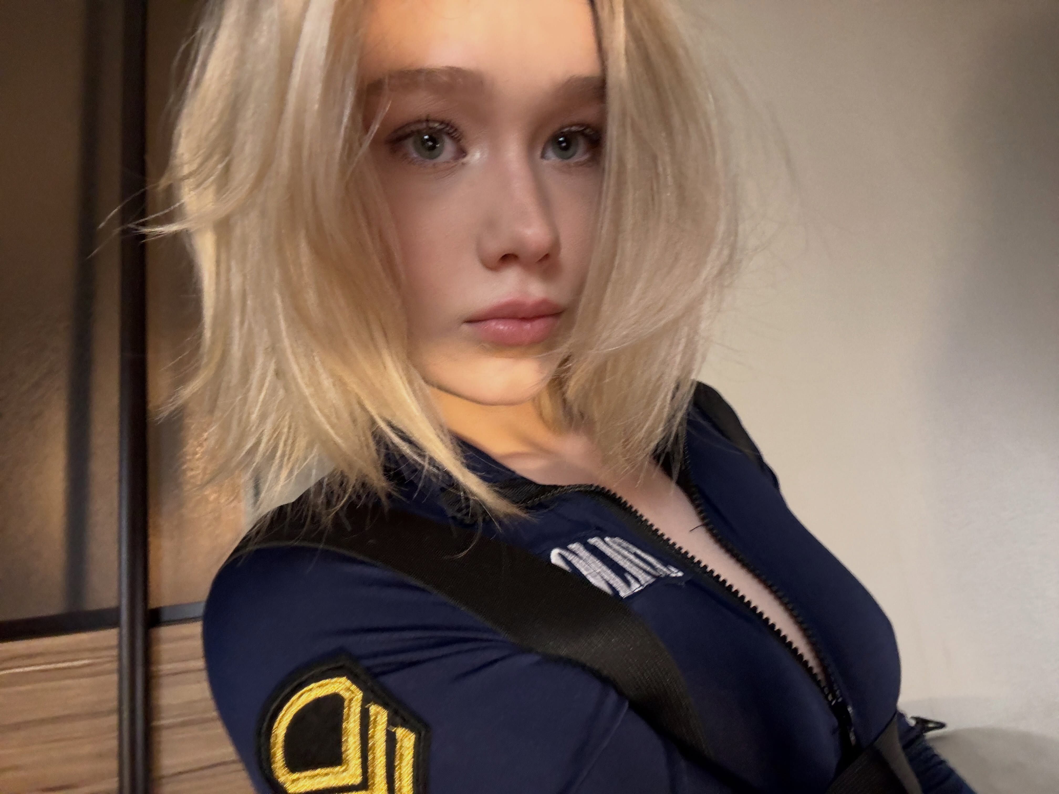 tollysage wearing dark blue jumpsuit