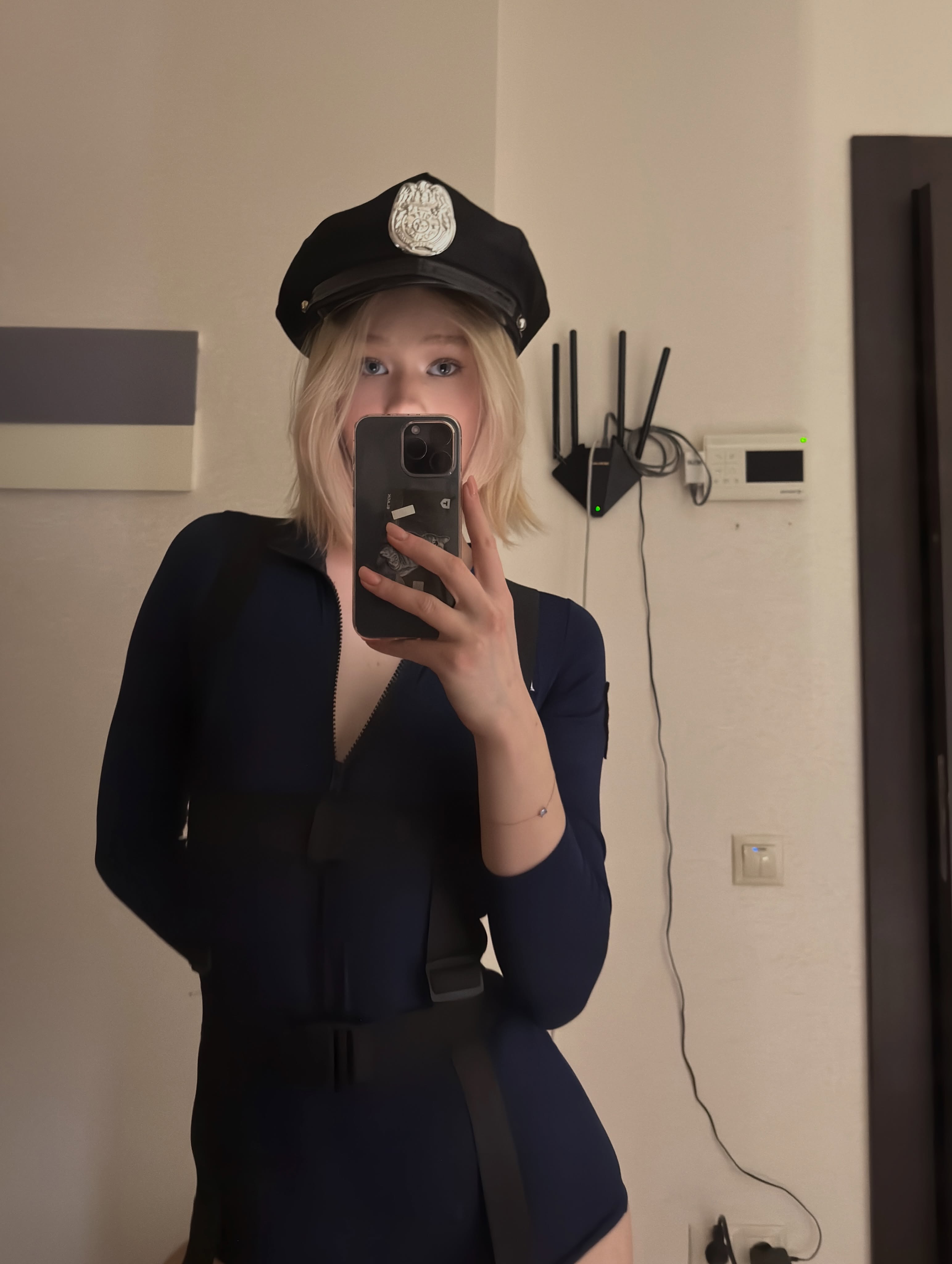tollysage taking a mirror selfie wearing navy blue bodysuit