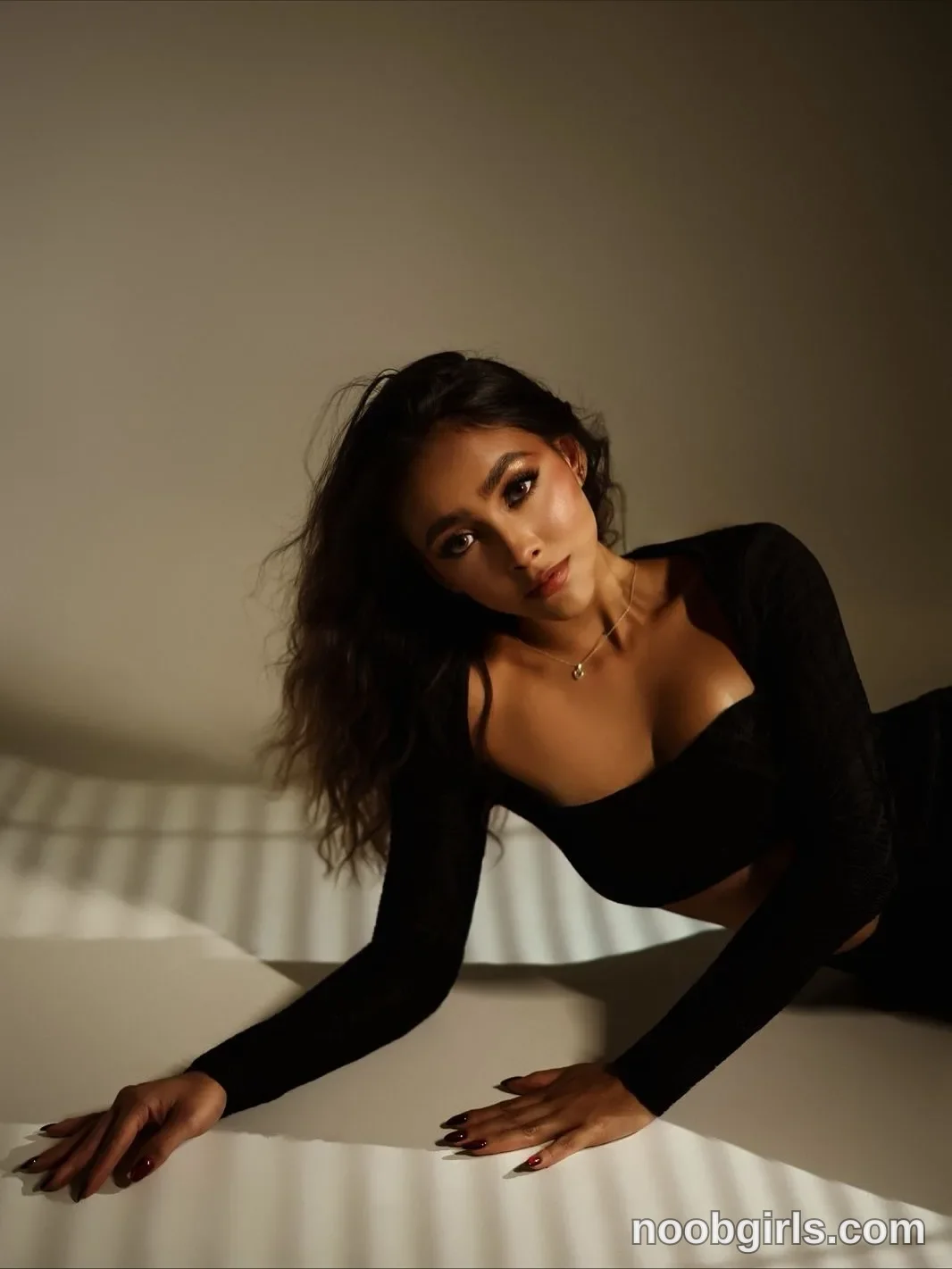 victoria__rossi Leaning sideways with both hands resting on the white surface