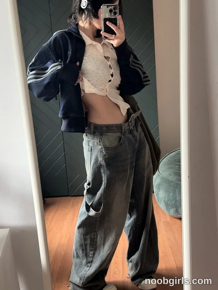 vivian_qwerty Standing in front of a mirror wearing Dark zip-front jacket with light-coloured stripes on the sleeves in room